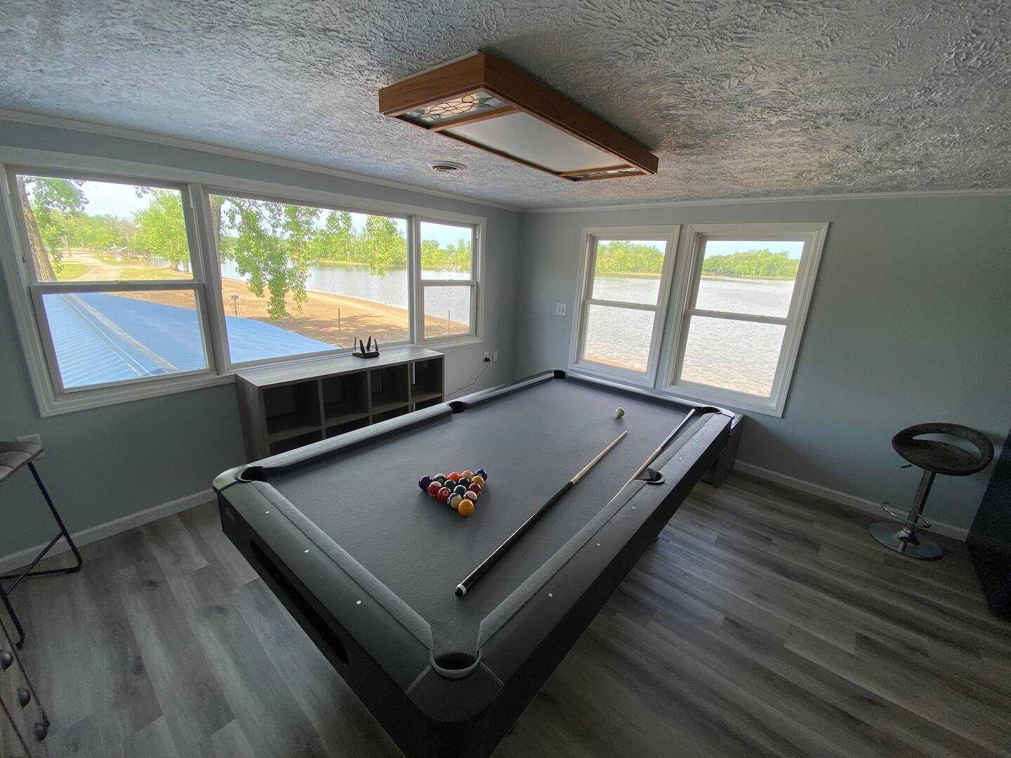 Pool table and game room at the Beach House at Lazy L Lake